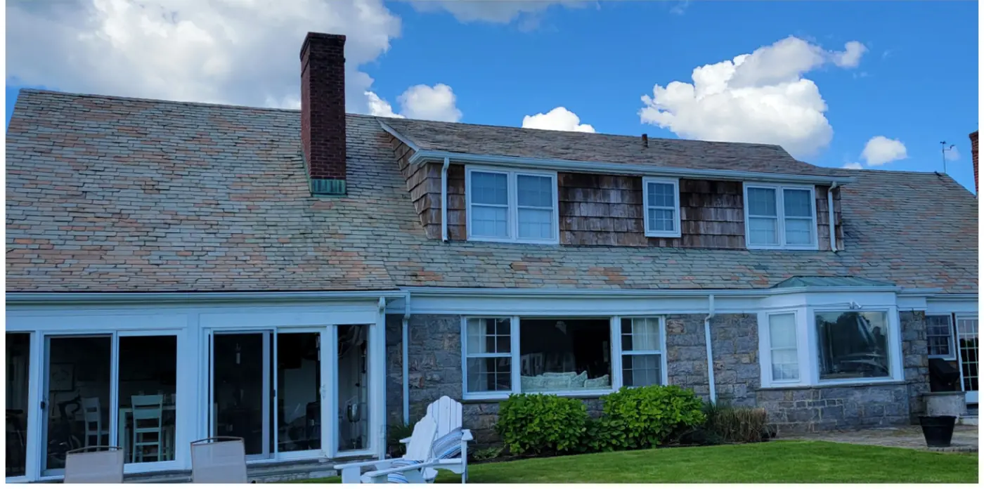 Stone and shingle home in Bay Shore after slate cleaning