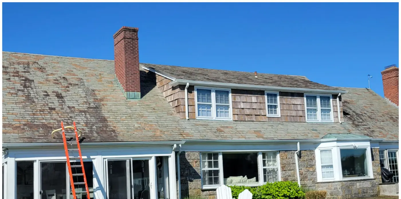 Stone and shingle home in Bay Shore before slate cleaning