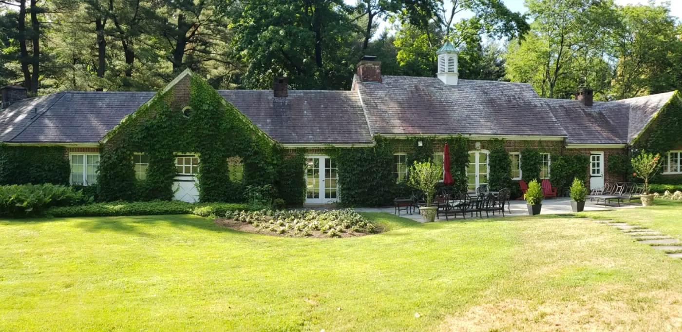 Ivy-covered brick estate in East Norwich before slate cleaning