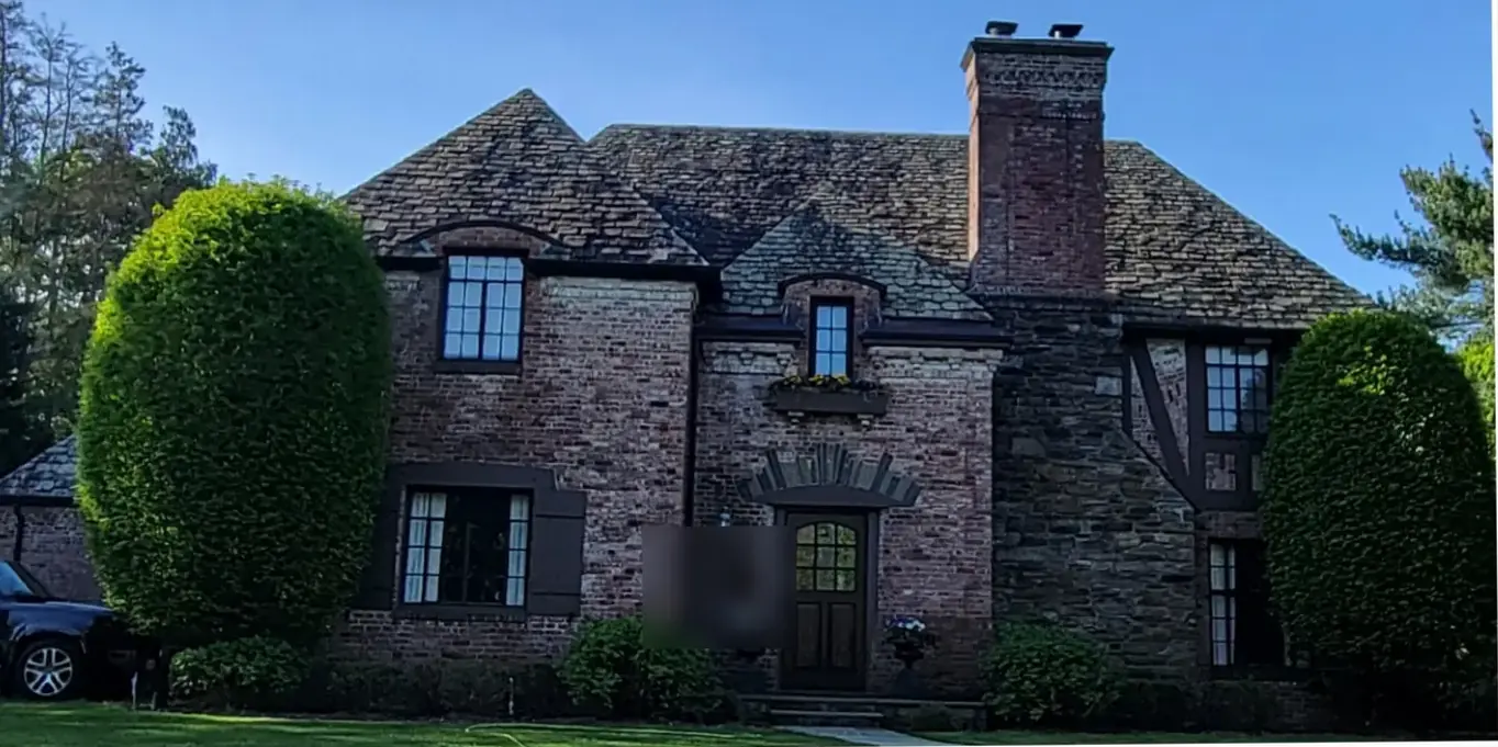Tudor with thick, textured slate in Garden City before slate cleaning