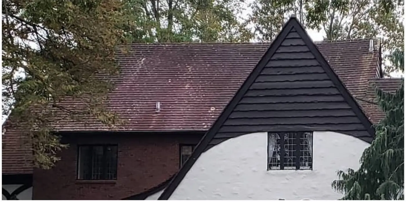 Tudor with a clay tile roof in Great Neck before slate cleaning