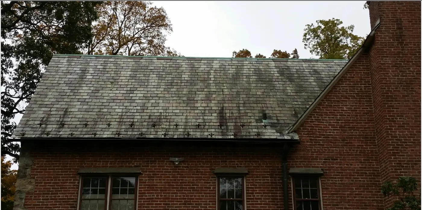Side slope with snow guards in Huntington before slate cleaning