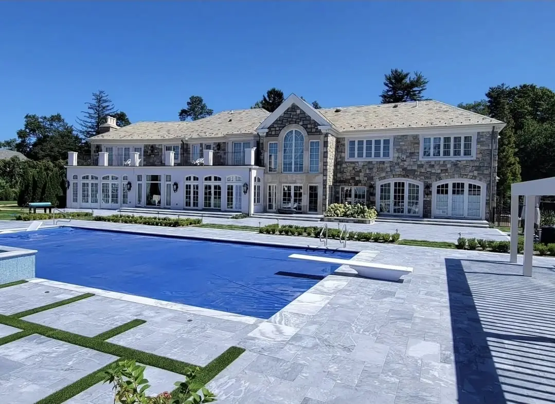 Stone home with multicolor slate, rear, Kings Point
