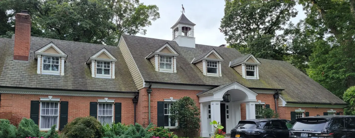 Entry and cupola in Locust Valley before slate cleaning