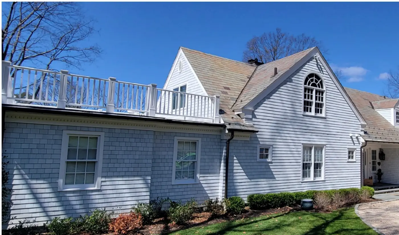 Same home, side and deck in Mill Neck after slate cleaning