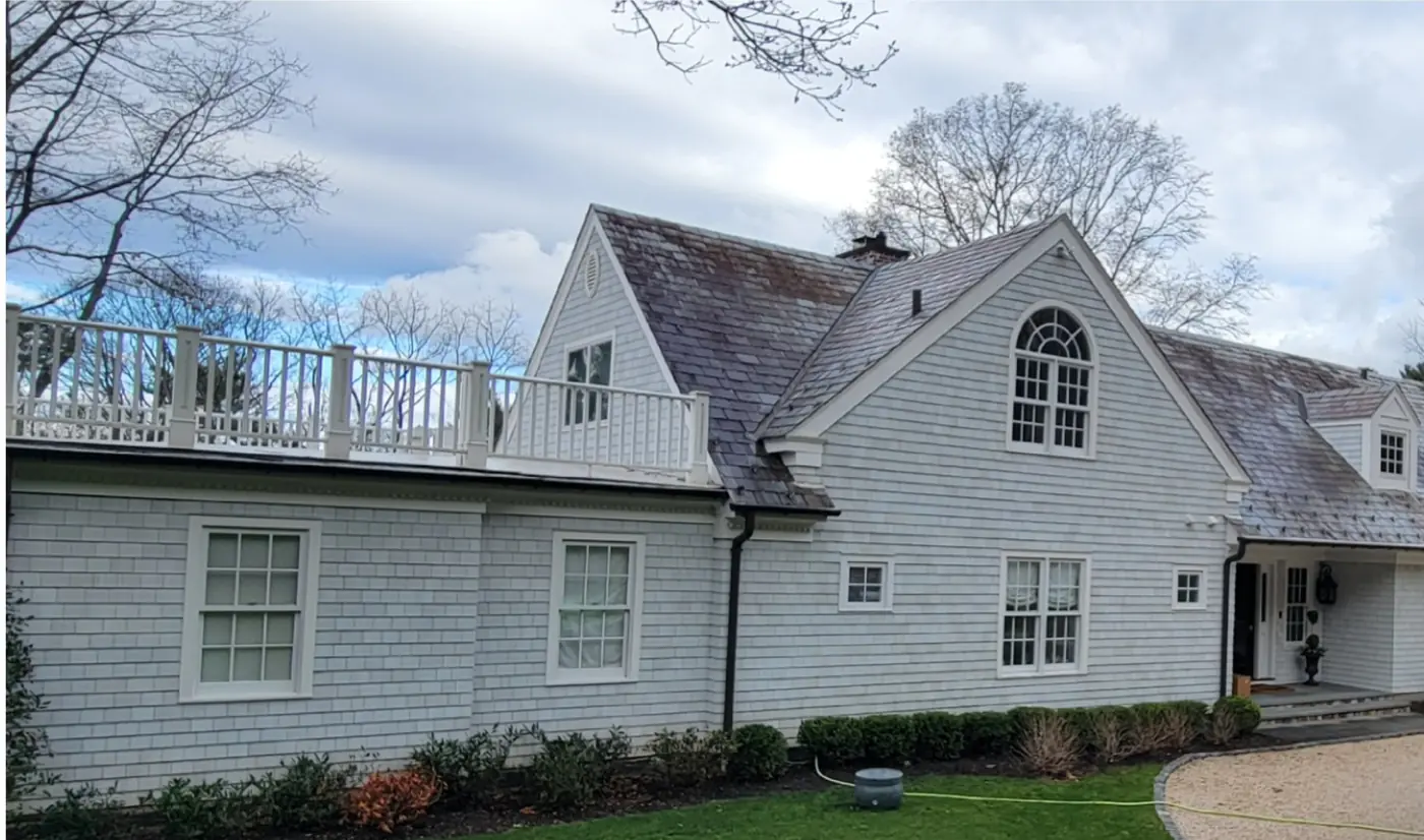 Same home, side and deck in Mill Neck before slate cleaning