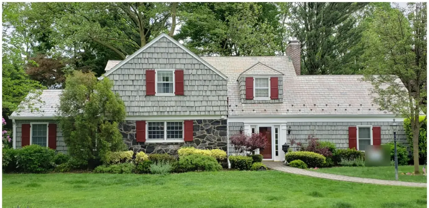Classic colonial with snow guards in Port Washington after slate cleaning