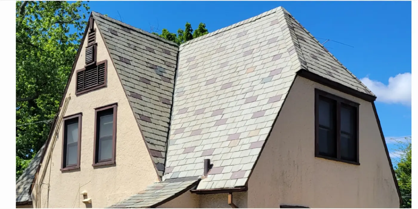 Stucco Tudor with steep gables in Rockville Centre after slate cleaning