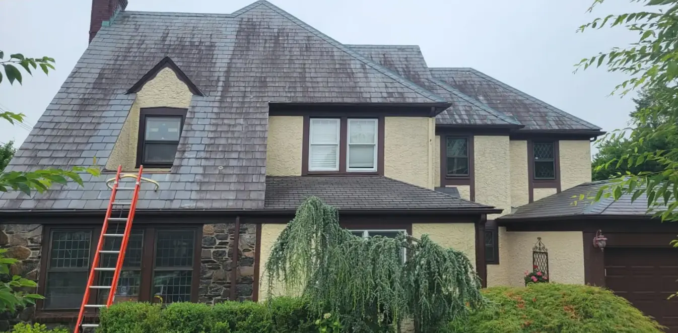 Stucco Tudor with stone and slate in Roslyn before slate cleaning